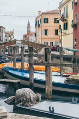 Fototapeta na wymiar Boats in the canals of Chioggia old town in Veneto, Italy