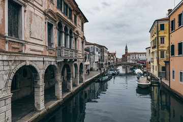 Fototapeta na wymiar Old buildings and canals of Chioggia city in Veneto, Italy