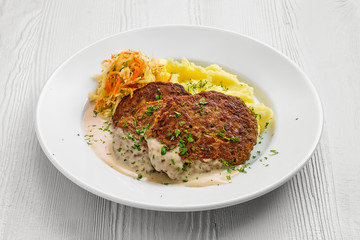 Fototapeta premium Plate with liver cutlet,mashed potato and pickled cabbage