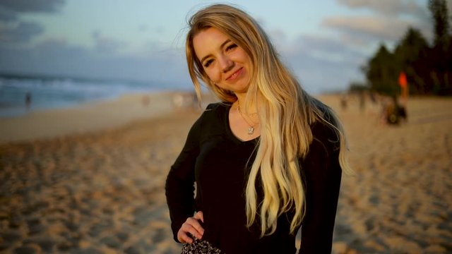 Beautiful Young Woman Smiling and Laughing on a Beach in Hawaii