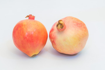 The still life photos of beautiful pomegranate fruit and pulp on a white background.