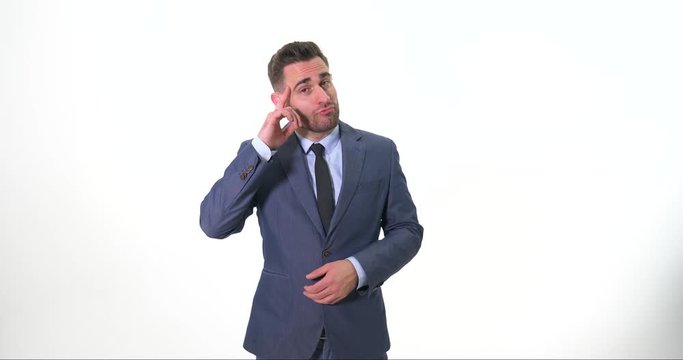 Young suited Guy show hands gestures and signals while smiling and making faces