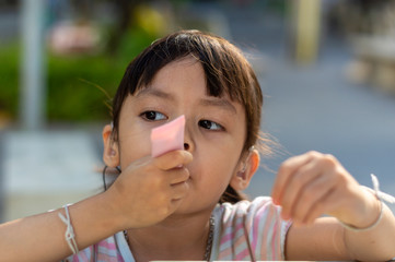 Hearing impaired children playing on the table in the park.