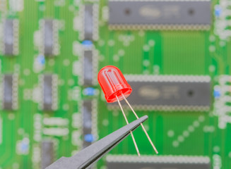 Electronic component held with tweezers