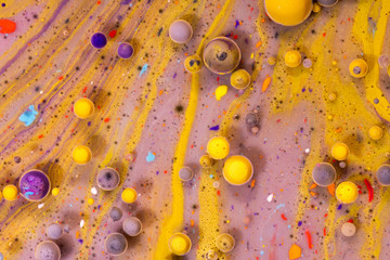 Macro universe, platnets and stars in it, multi-colored paints.