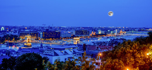 Bridges over the Danube river in Budapest at night.