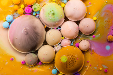 Macro universe, platnets and stars in it, multi-colored paints.