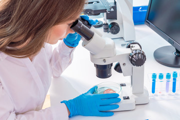 Young woman in food quality control lab