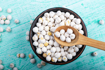 dry chickpeas on wooden background