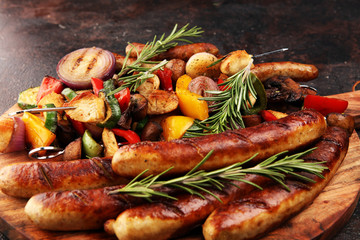 Assorted delicious grilled meat with vegetable on a barbecue with Grilled pork shish or kebab on skewers with vegetables.