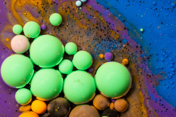 Macro universe, platnets and stars in it, multi-colored paints.