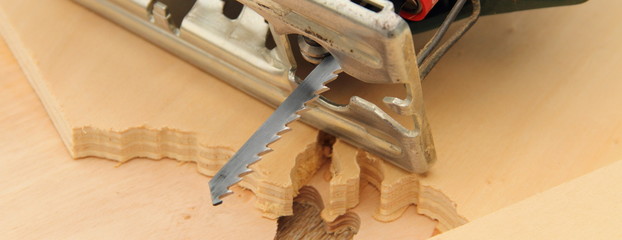a jigsaw with sawn wood