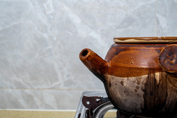 Decoction of a medicine jar on a kitchen stove