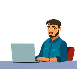 Business man at the desktop with a laptop. Freelancer or office worker.