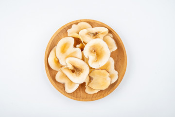 Dried seafood snails on a plate on white background
