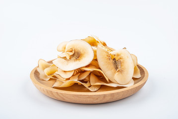 Dried seafood snails on a plate on white background