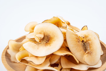 Dried seafood snails on a plate on white background