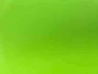 Colorful background, blurred green color on uneven surface,  colored spots on materials