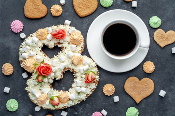 coffee and cake number plate of 8 decorated with flowers, cream of cheese, marshmallow, Bizet on a stone background. postcard International Women's Day March 8