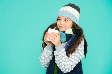 Pleasant sip. Kid winter fashion. Child warm knitwear. Have warming drink. Drinking hot cocoa. Hot...