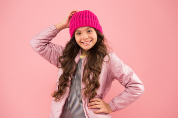 Accessories shop. Carefree and happy. Little kid wear puffer jacket and knitted hat. Winter shopping. Happy childhood. Trendy accessory. Tender style. Dress warm in winter. Ready for cold winter