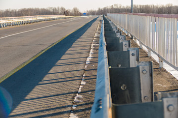 The bridge's metal railings extend into the distance