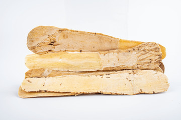 Astragalus medicinal herbs on white background