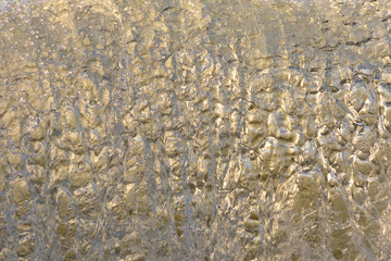 texture close up of a wave with golden glow