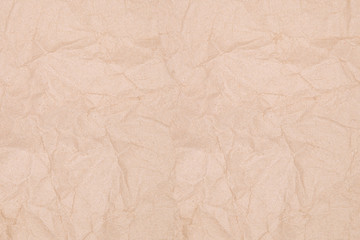 Rumpled texture of old kraft paper, background