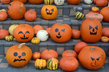 Halloween jack-o'-lantern pumpkins with a range of funny and spooky faces