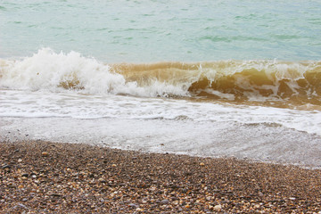 Wave on the beach background texture. Beautiful clear water lapping on the shore. waves on sea coast. 