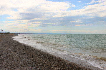 Wave on the beach background texture. Beautiful clear water lapping on the shore. waves on sea coast. 