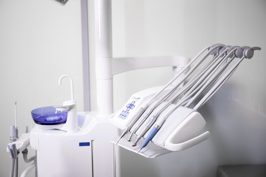 The workplace of the dentist with the dental unit and chair, close-up