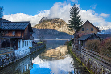 Fototapeta na wymiar Hallstatt, a charming village on the Hallstattersee lake and a famous tourist attraction, with beautiful mountains surrounding it, in Salzkammergut region, Austria, in winter sunny day.