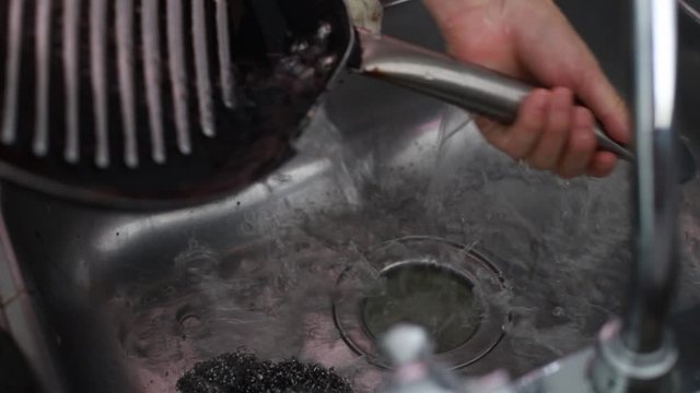 Woman’s Hands in Kitchen Sink Rinse Frypan Under Running Water, Close