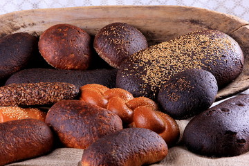 Fresh collection of bread and wheat on the table. Collection of different types of bread: White, rye, seed, form bread. lots of photos of bread with rye ears