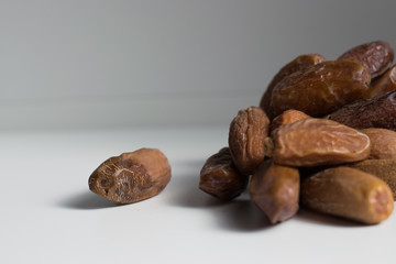 dried dates palm on white background