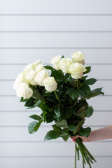 Beautiful bouquet of mixed flowers with roses. The work of the florist. Flower delivery