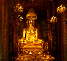 Golden Buddha on the altar of the Buddhist temple of Wat Bowonniwetwiharn Ratchaworawiharn, Bangkok, Thailand.
