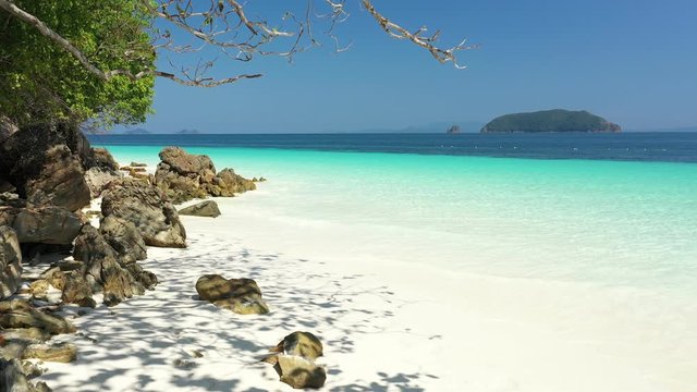 Aerial view of ocean waves, Beautiful tropical beach and rocky coastline and beautiful forest. Nyaung Oo Phee Island Myanmar