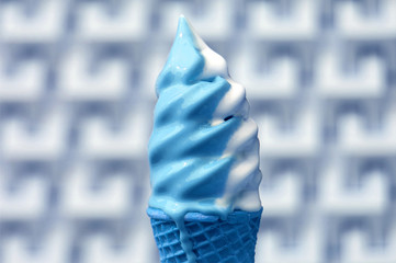 Melting White and Blue Soft Serve Ice Cream Cone Against Blurry Modern Concrete Wall in Pop Art Style