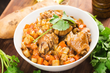 Chicken with potato and carrot in curry,