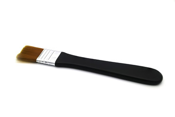 Black paintbrush isolated on a white background.