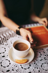 Hand take a hot chocolate in cafe