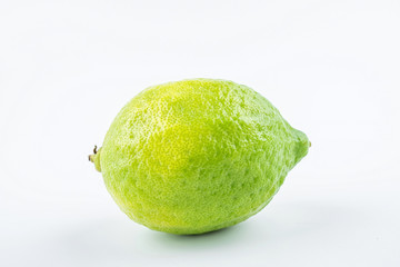 Fresh green lemon on white background