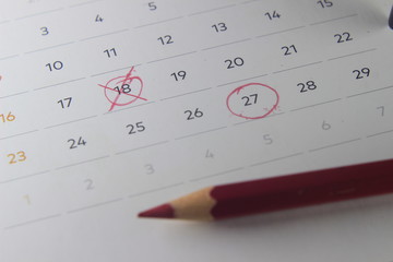 Simple Top View Close Up Photo Illustration, Re-Schedule Marked by man Hand with Red Color Pencil,...