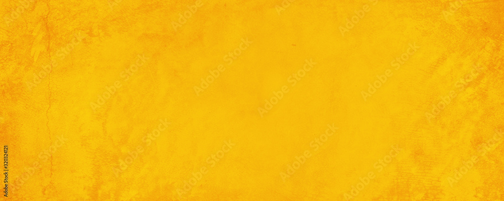 Wall mural Horizontal yellow and orange texture cement wall background