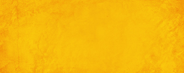Horizontal yellow and orange texture cement wall background