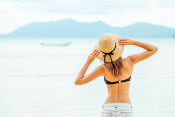 Fototapeta na wymiar Woman enjoying beach relaxing in summer