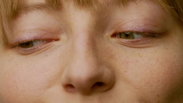 Beautiful expressions of a polish woman with green eyes, closeup